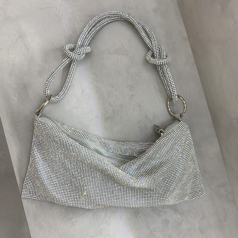 Bolsa Metálica Acabamento Brilhante Prisma Aurora, Elegância Que Atrai Todos os Olhares